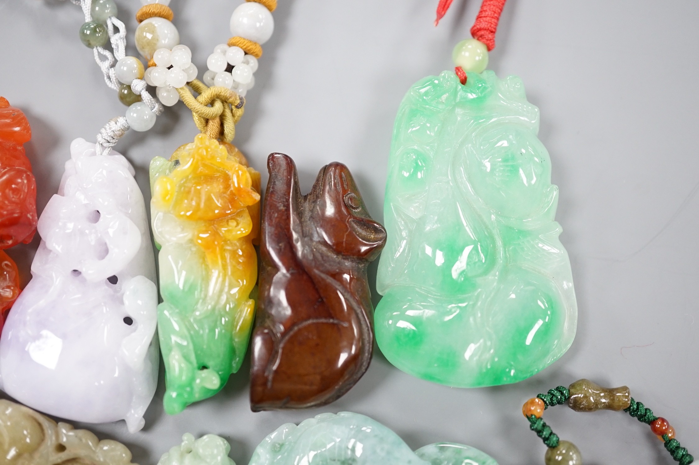 A group of ten jadeite and hardstone carvings and pendants